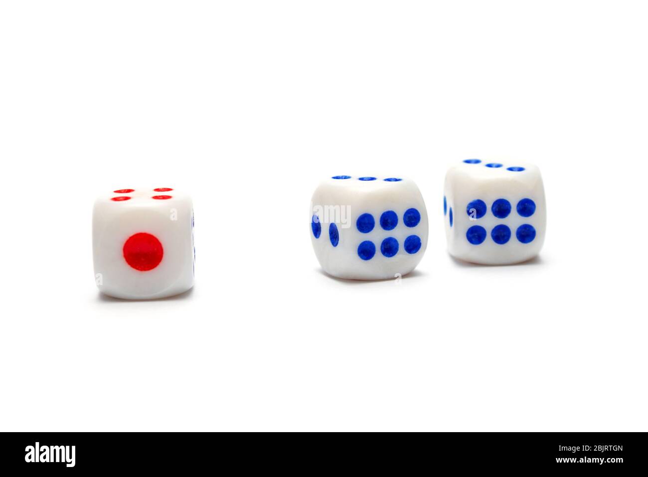 Three dice, one red and two blue on a white background. isolate Stock Photo
