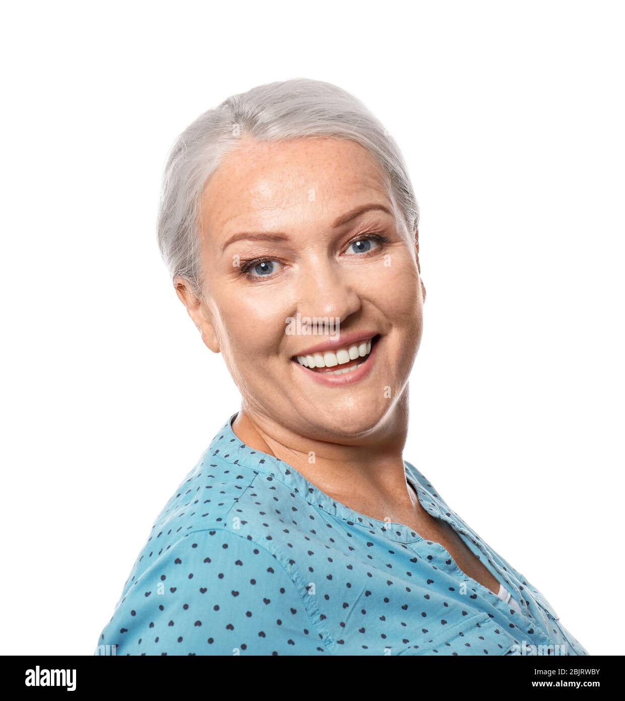 Portrait of smiling mature woman on white background Stock Photo - Alamy