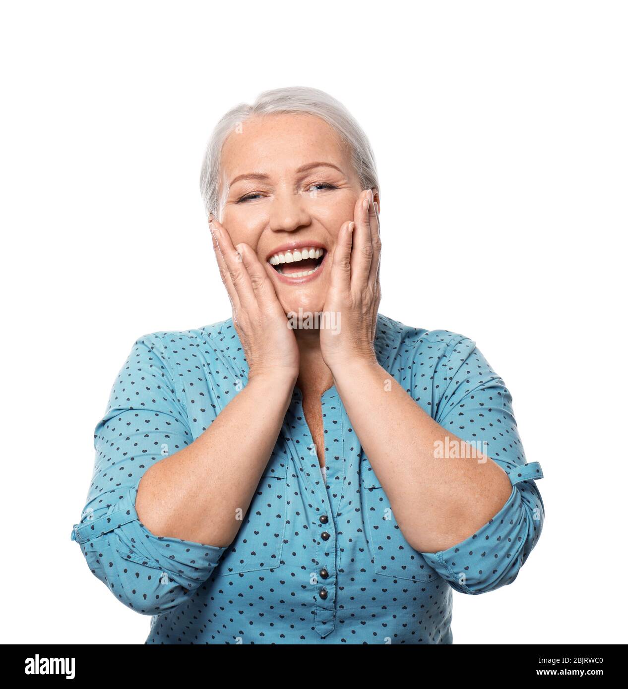 Portrait of smiling mature woman on white background Stock Photo - Alamy