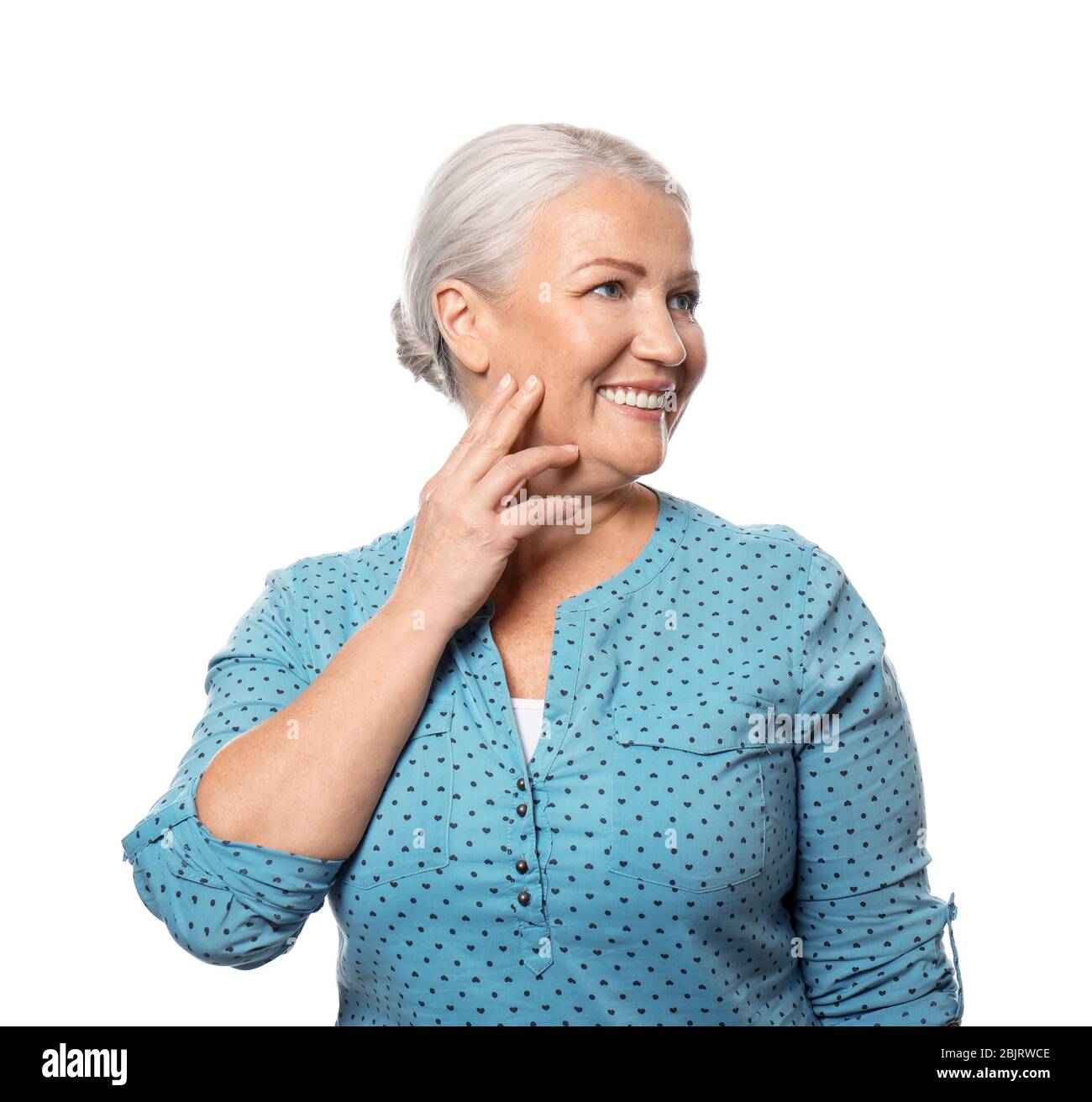 Portrait of smiling mature woman on white background Stock Photo - Alamy