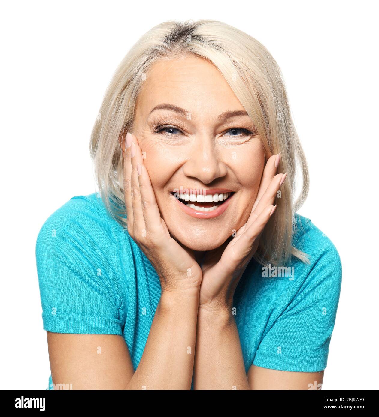 Portrait of smiling mature woman on white background Stock Photo - Alamy