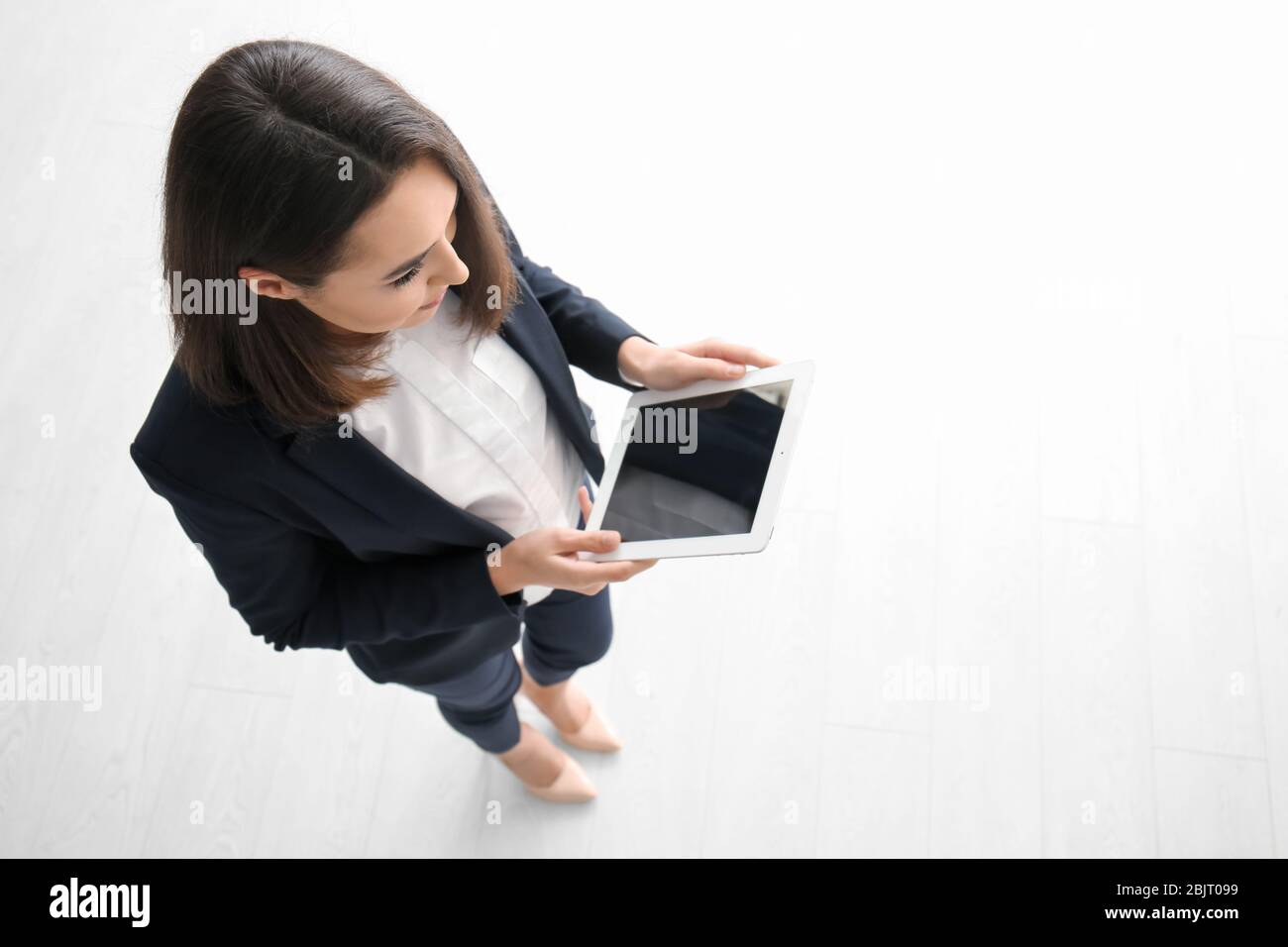 Young lawyer with tablet computer indoors Stock Photo - Alamy