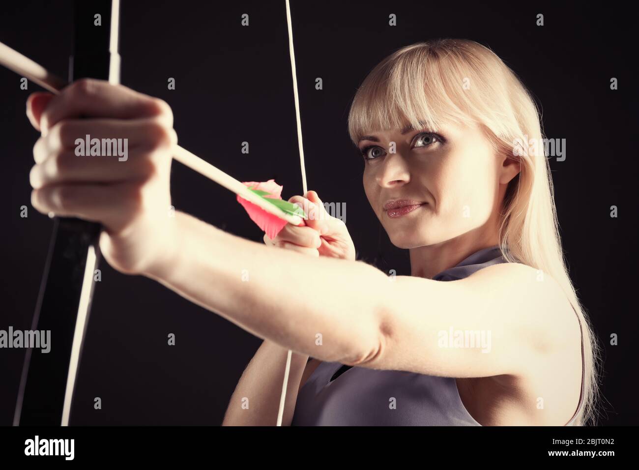 Beautiful woman aiming bow arrow hi-res stock photography and images ...