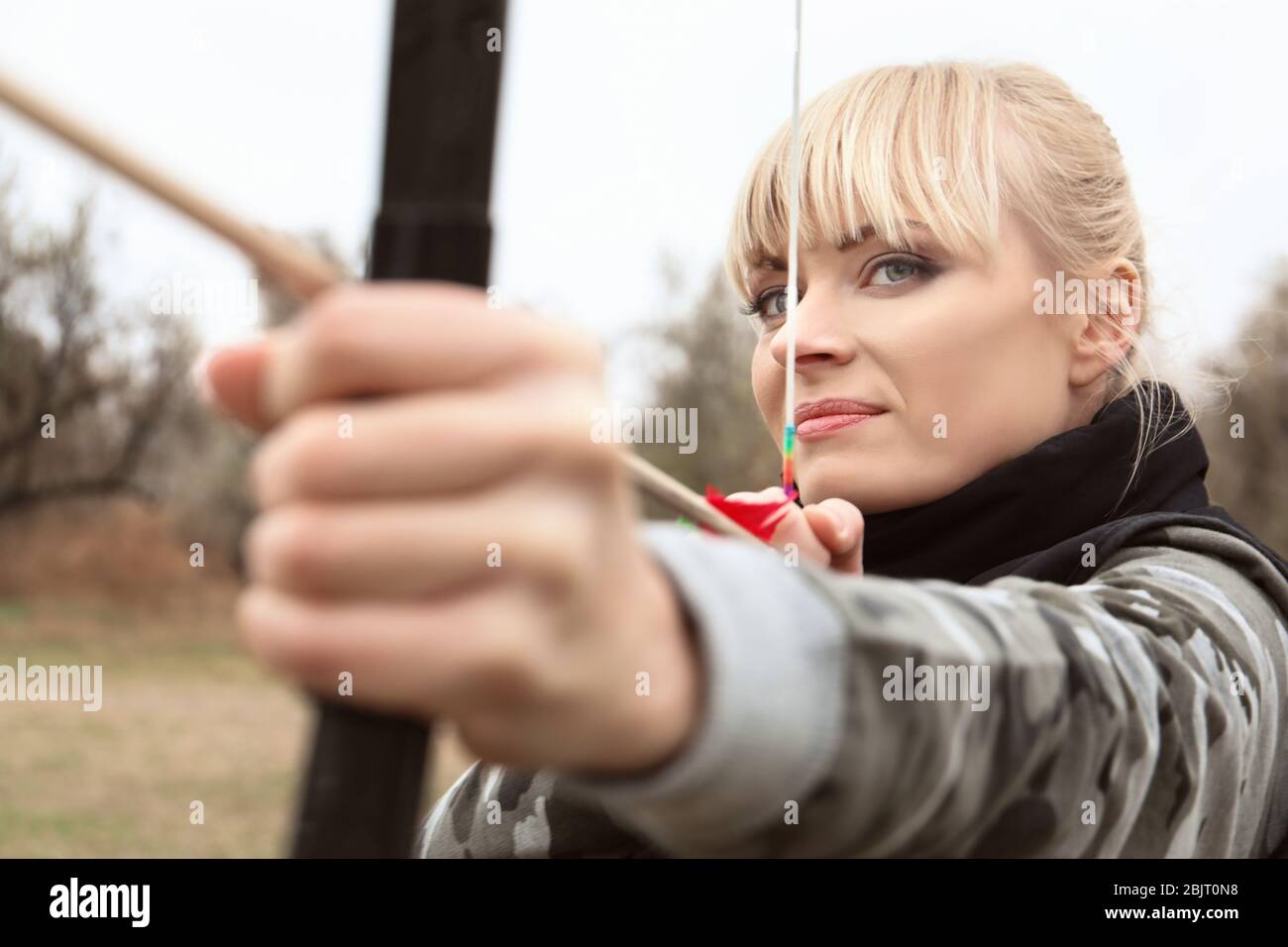 Beautiful woman aiming bow arrow hi-res stock photography and images ...