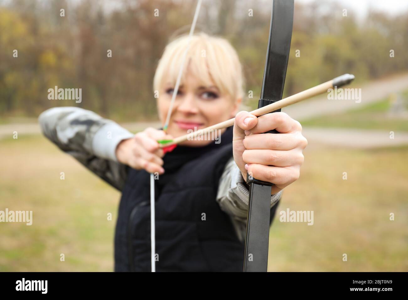 Beautiful woman aiming bow arrow hi-res stock photography and images ...