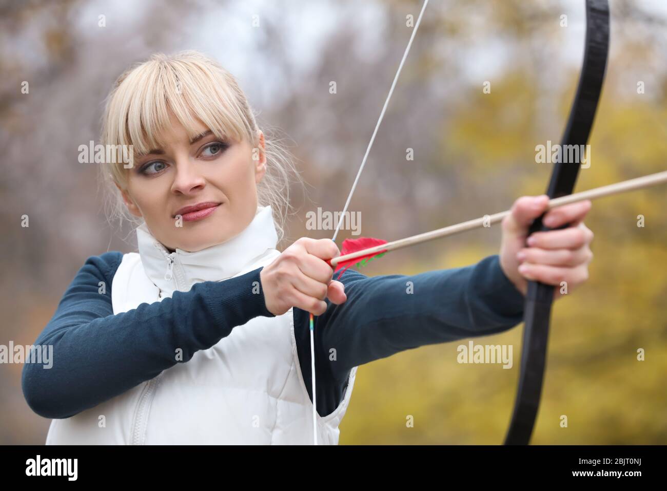 Beautiful woman aiming bow arrow hi-res stock photography and images ...