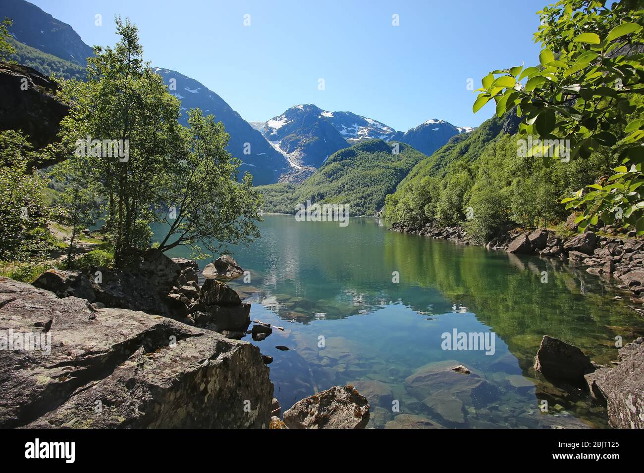 Bondhus Lake with beautiful scenery & reflections in the water. Reached along the mountain hike, near Rosendal, Folgefonna National Park, Norway. Stock Photo