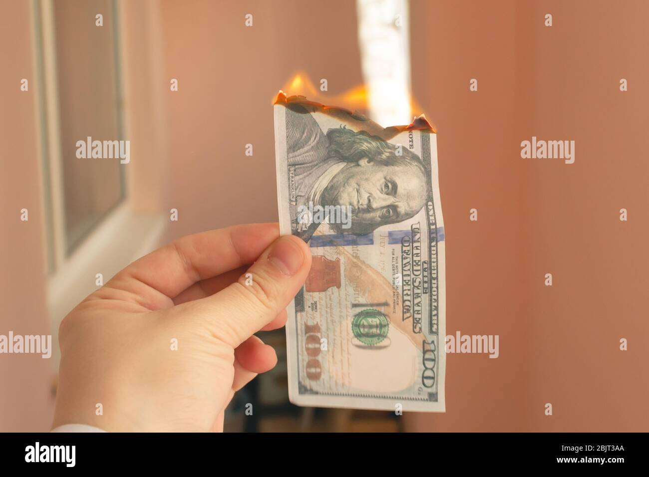 hundred dollar bill burns on a light background Stock Photo Alamy