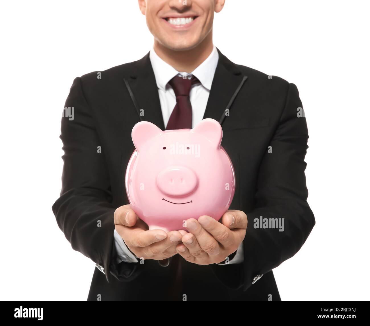 Man in office wear holding piggy bank on white background Stock Photo ...