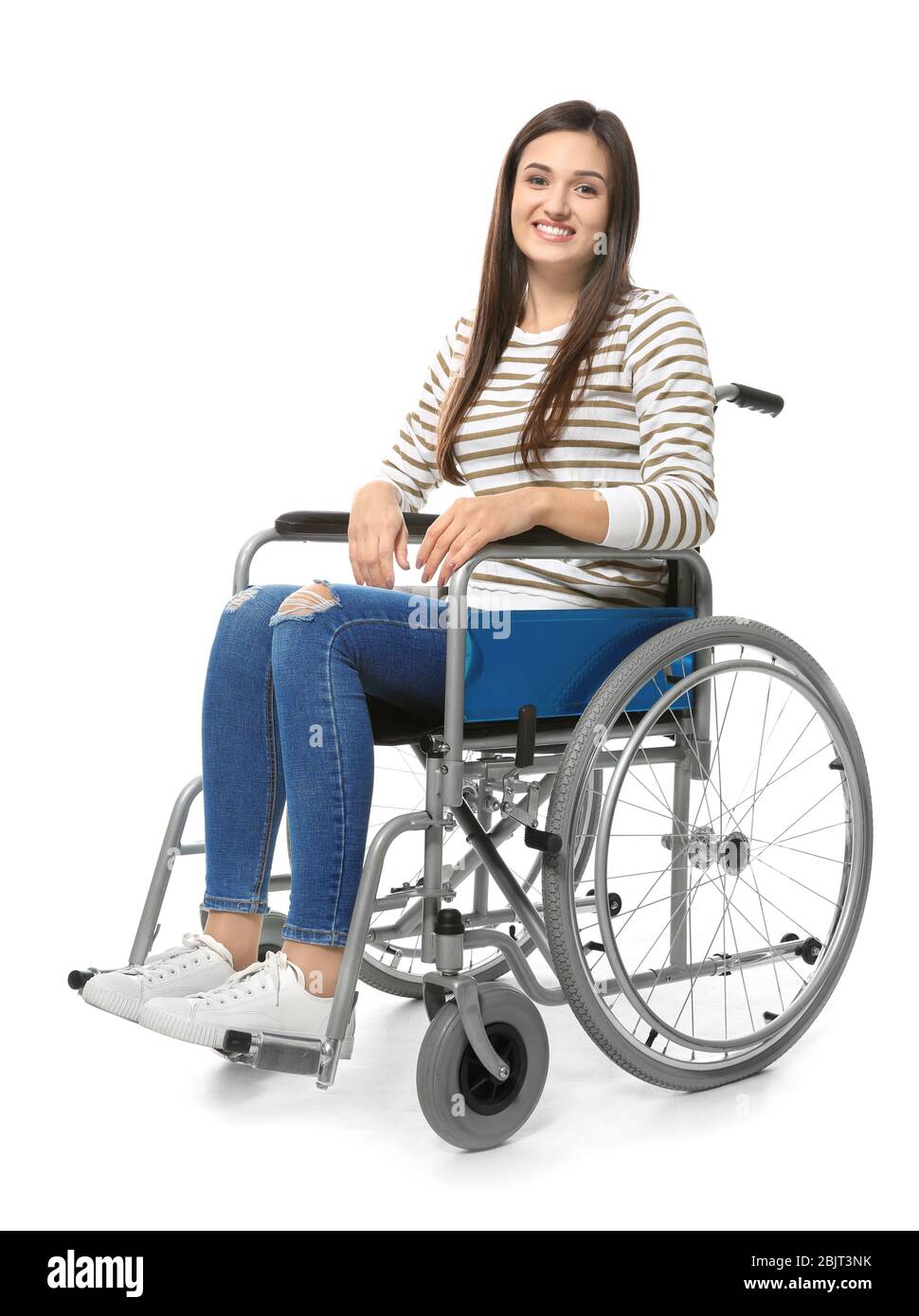 Young woman in wheelchair on white background Stock Photo - Alamy