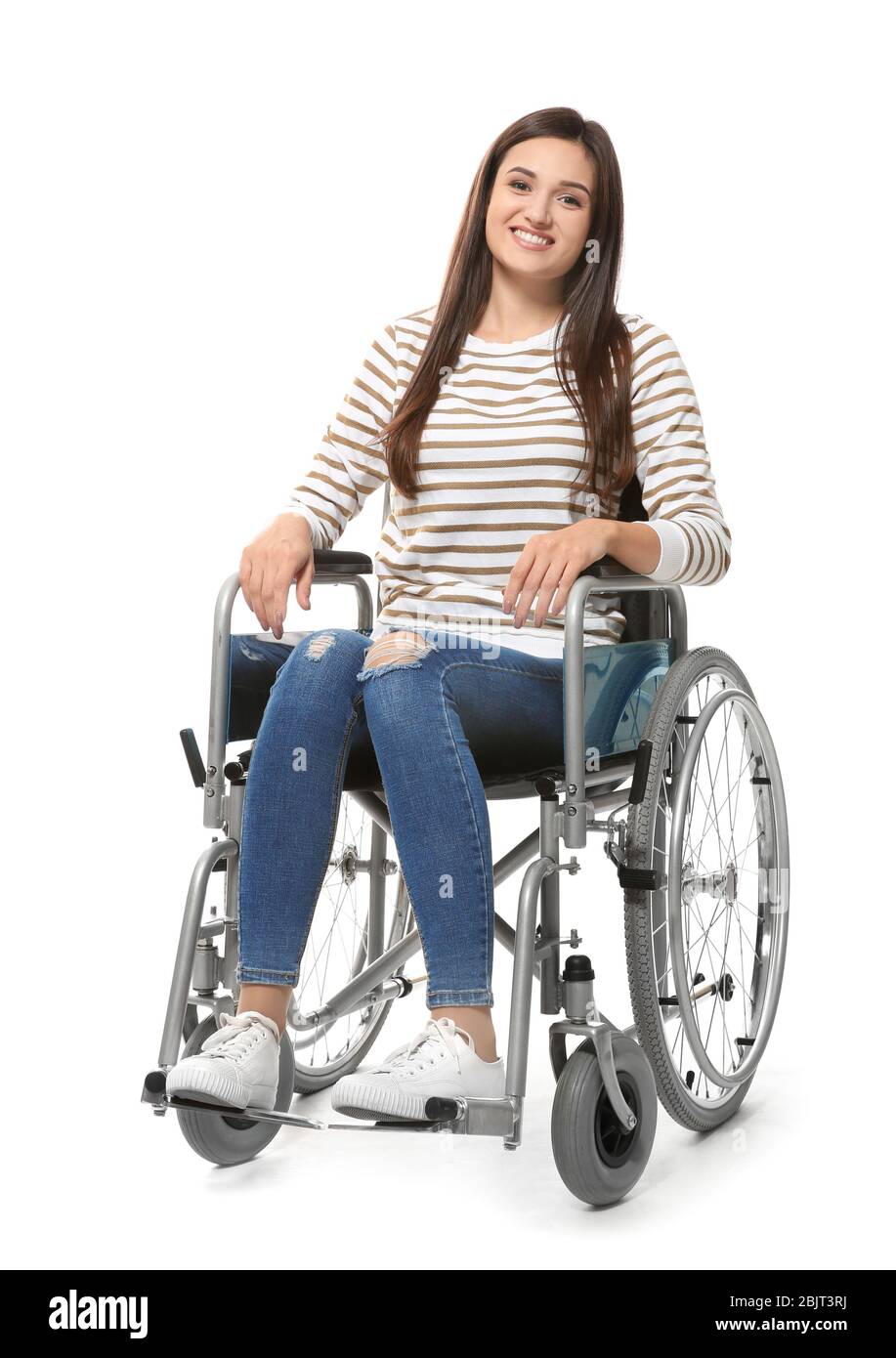 Young woman in wheelchair on white background Stock Photo - Alamy