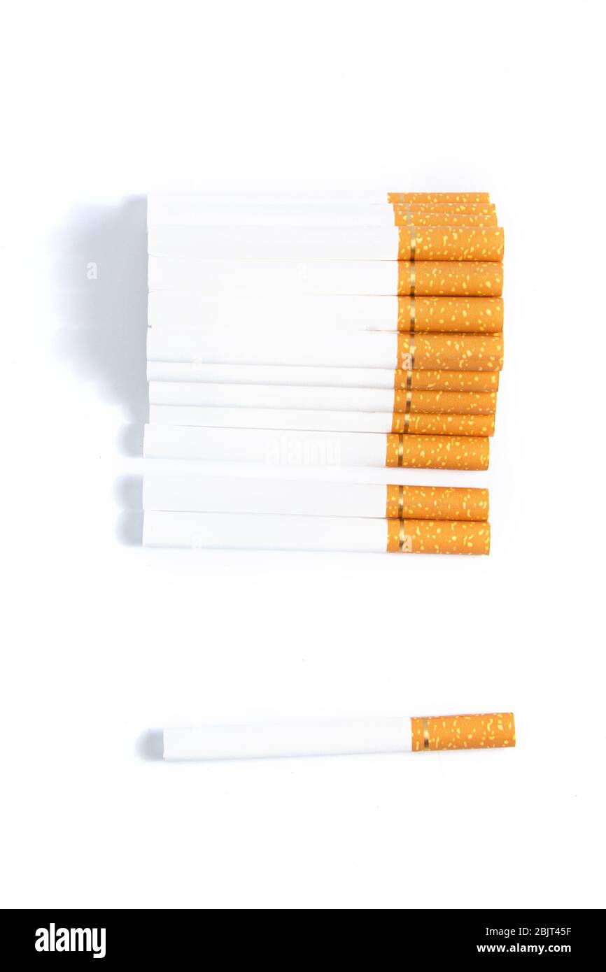 orange colored cigarettes with a gold ribbon on a white background ...