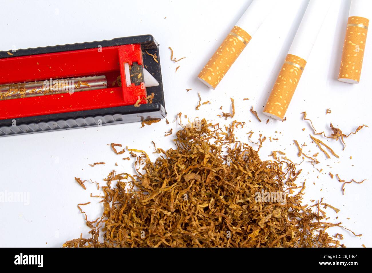sleeve of tobacco machine for driving tobacco into a sleeve with tobacco and sleeves on a  white background. isolate Stock Photo