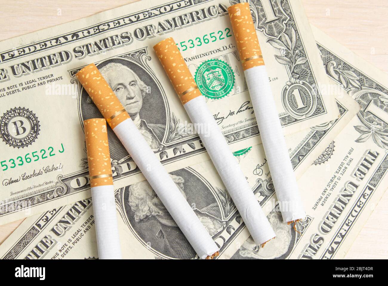 one dollar bill tobacco cigarettes Stock Photo Alamy