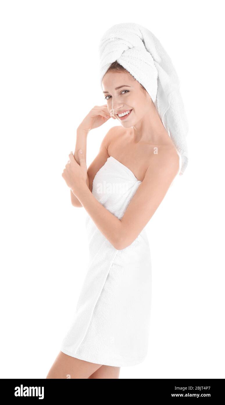 Attractive young woman in towel on white background Stock Photo - Alamy