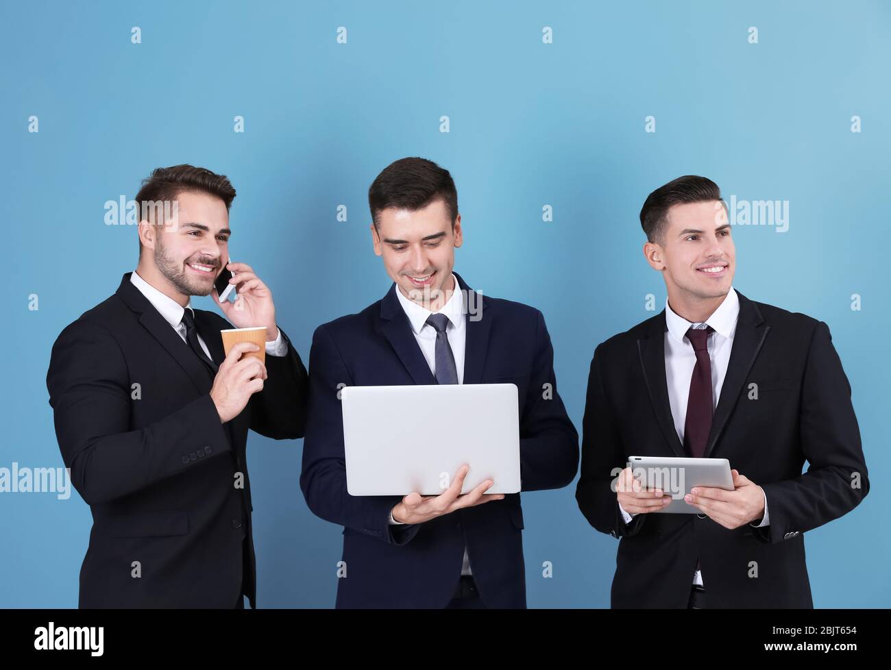 Men in grey suits hi-res stock photography and images - Alamy