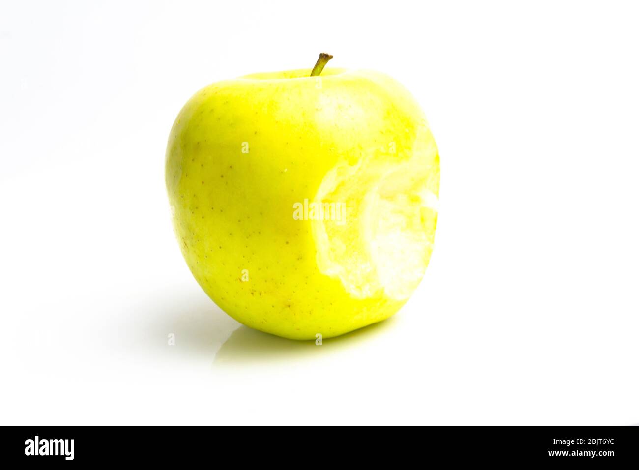 bitten green apple on a white background. close up Stock Photo