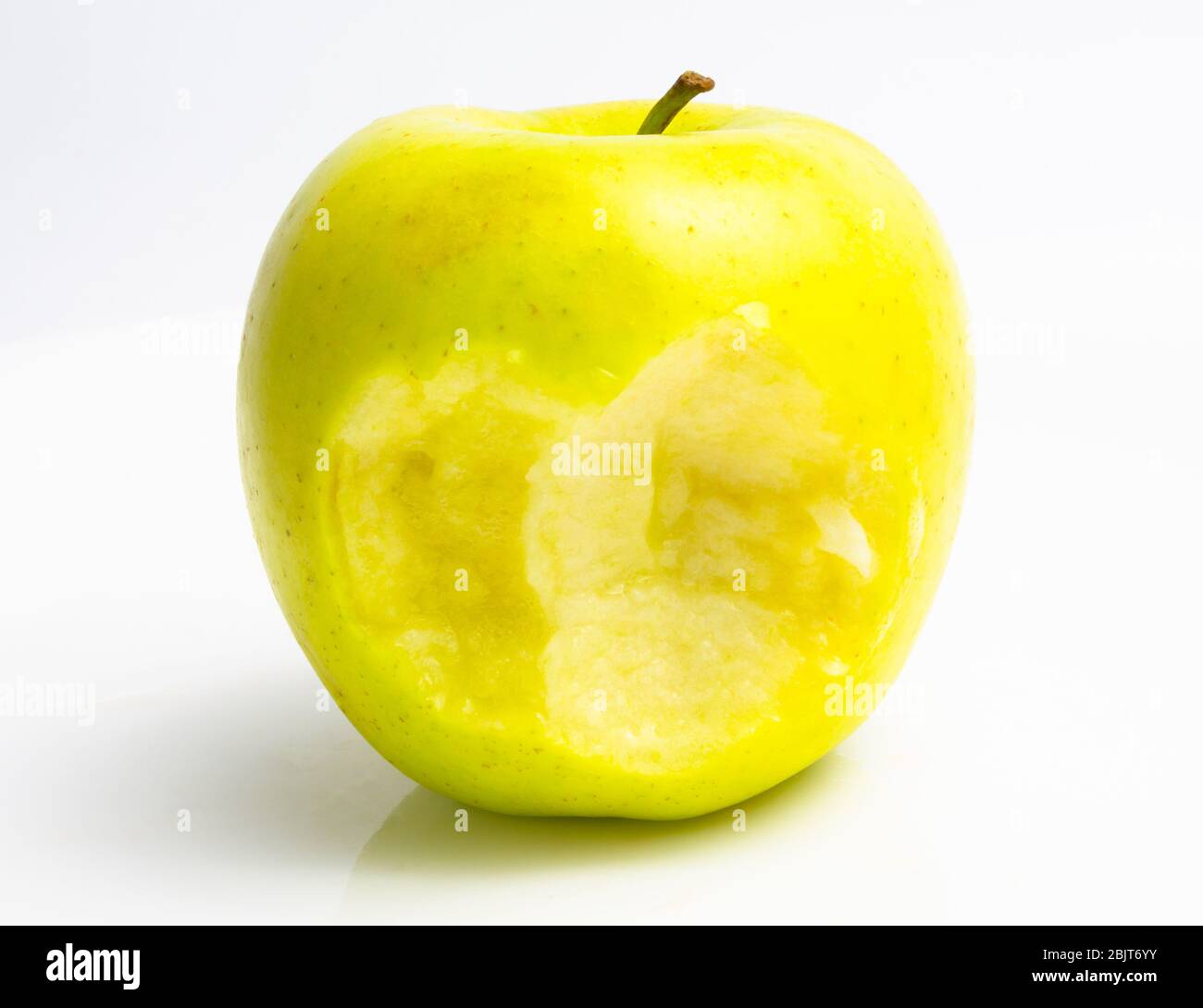 bitten green apple on a white background. close up Stock Photo