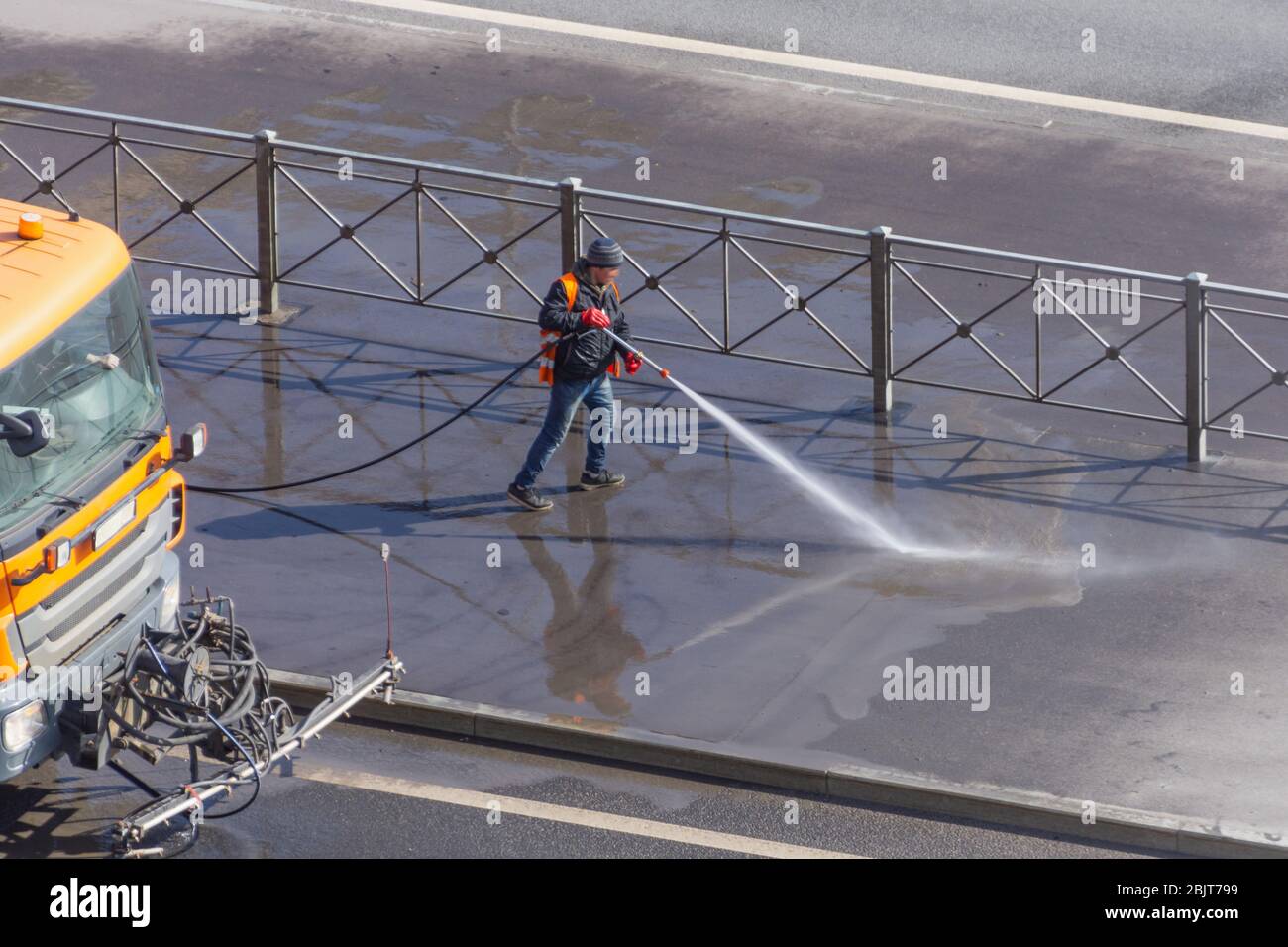 Man hose clean driveway street hi-res stock photography and images - Alamy