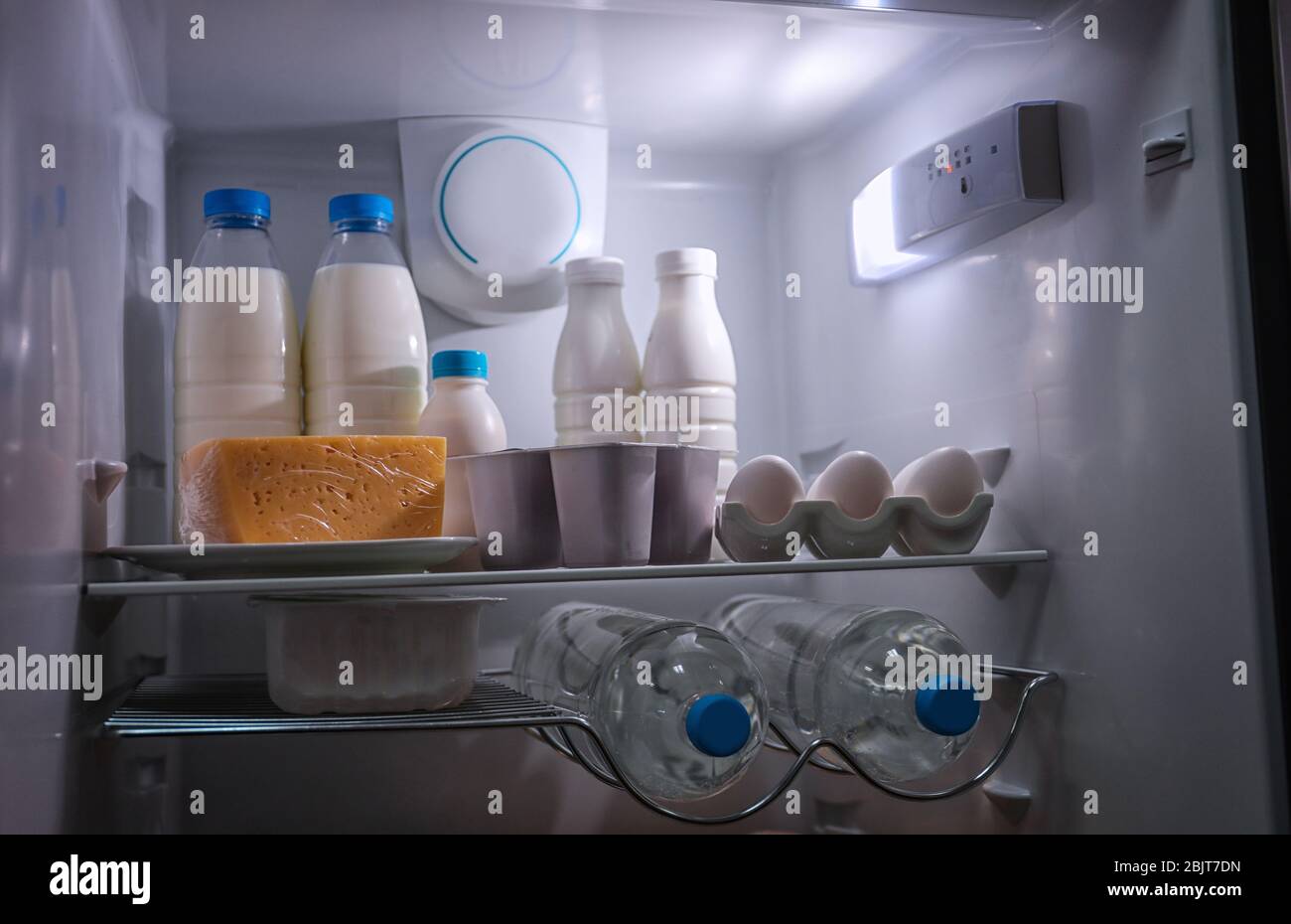 Many different dairy products in modern refrigerator Stock Photo Alamy