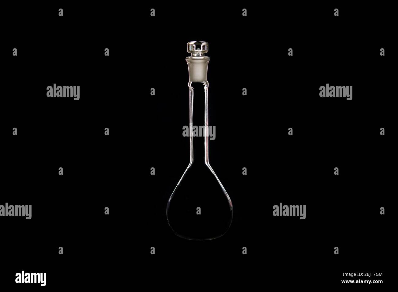 glass bottle flask on a black background Stock Photo Alamy