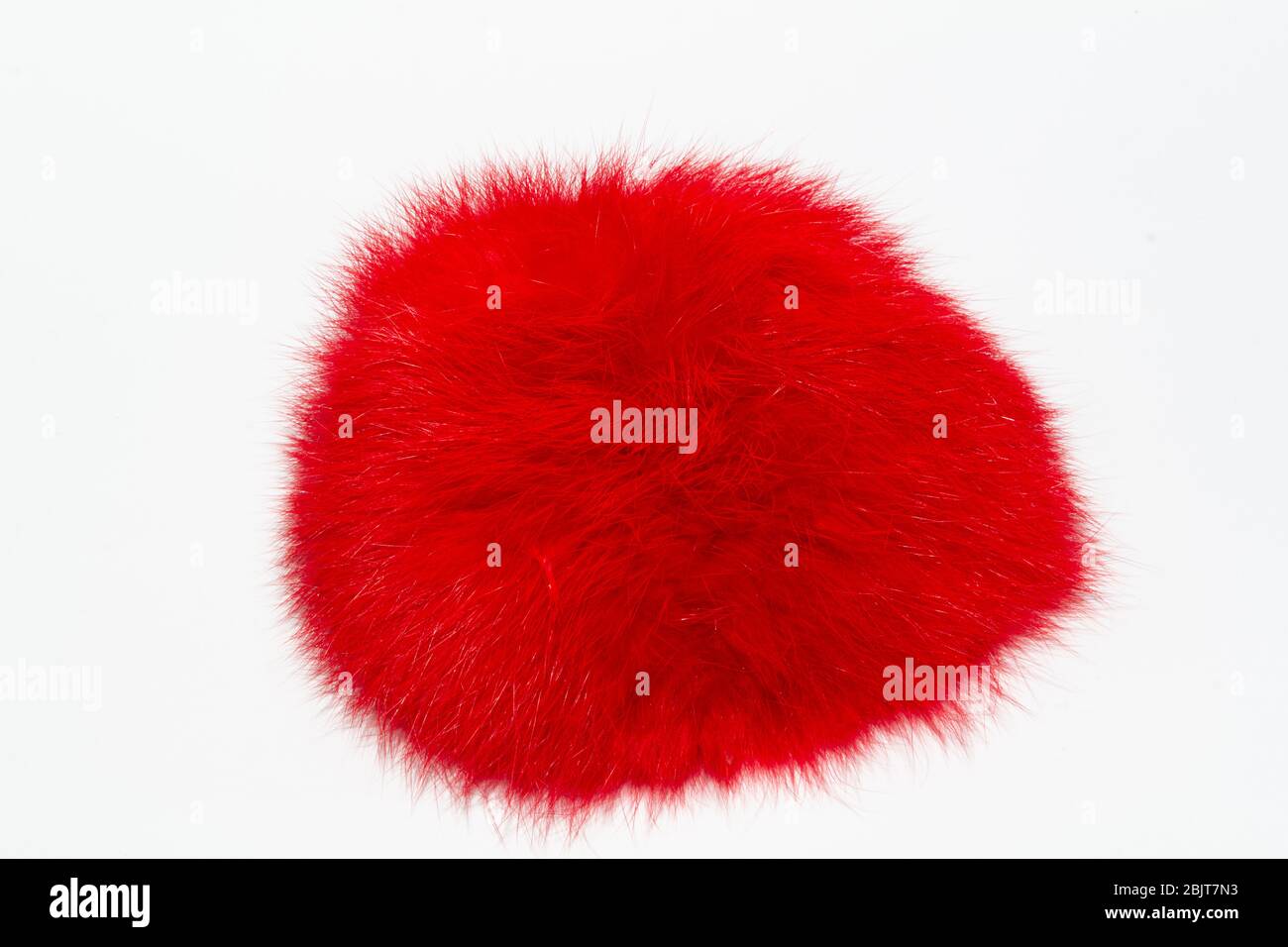 Red fluff on a white background Stock Photo - Alamy