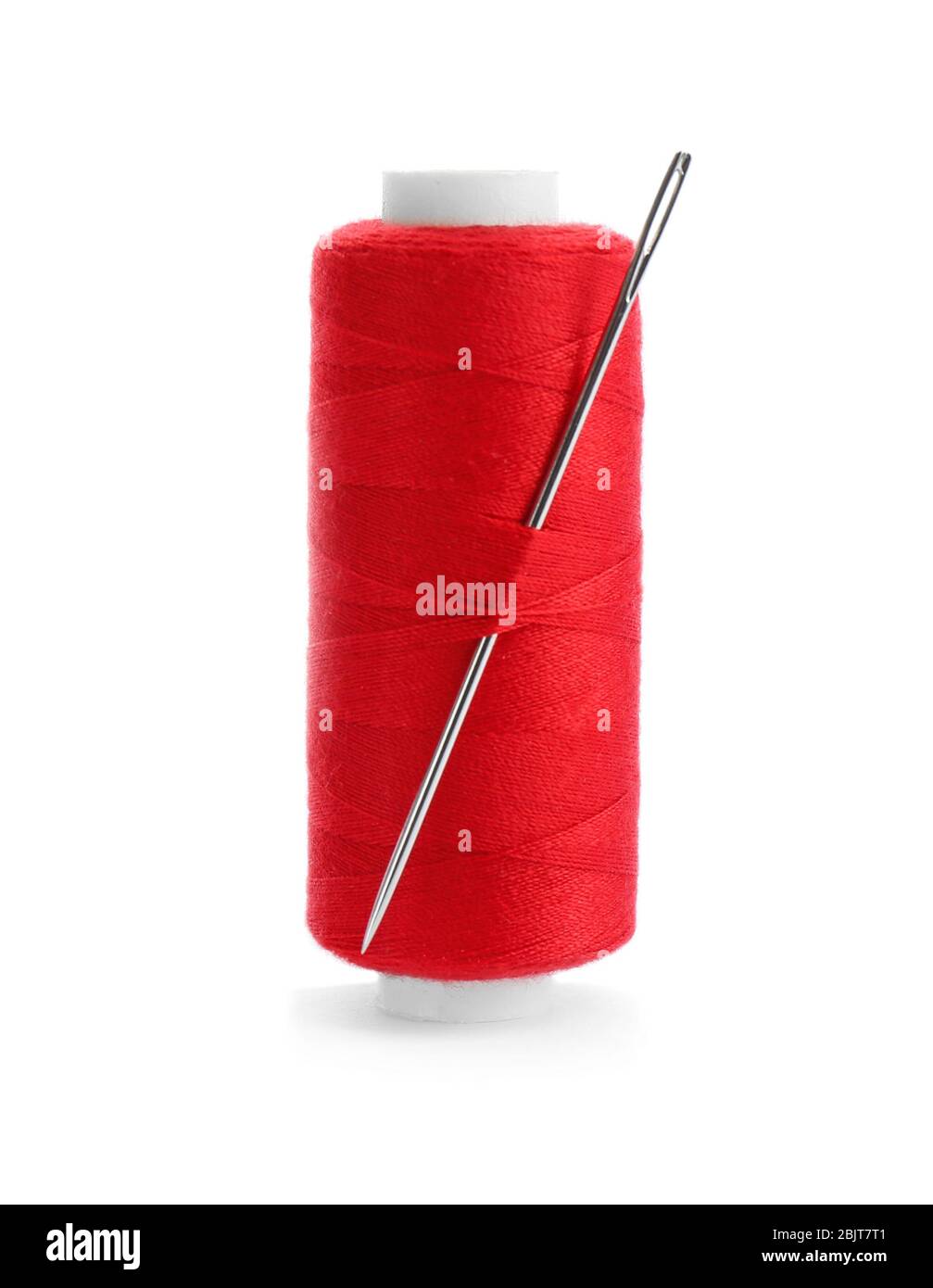 Red thread and needle on white background Stock Photo - Alamy