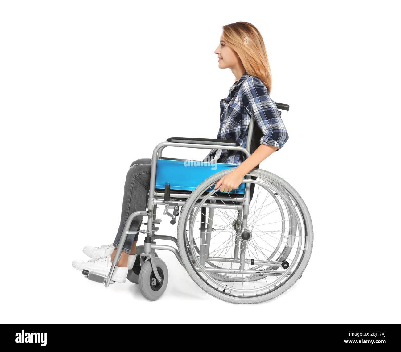 Young woman in wheelchair on white background Stock Photo - Alamy