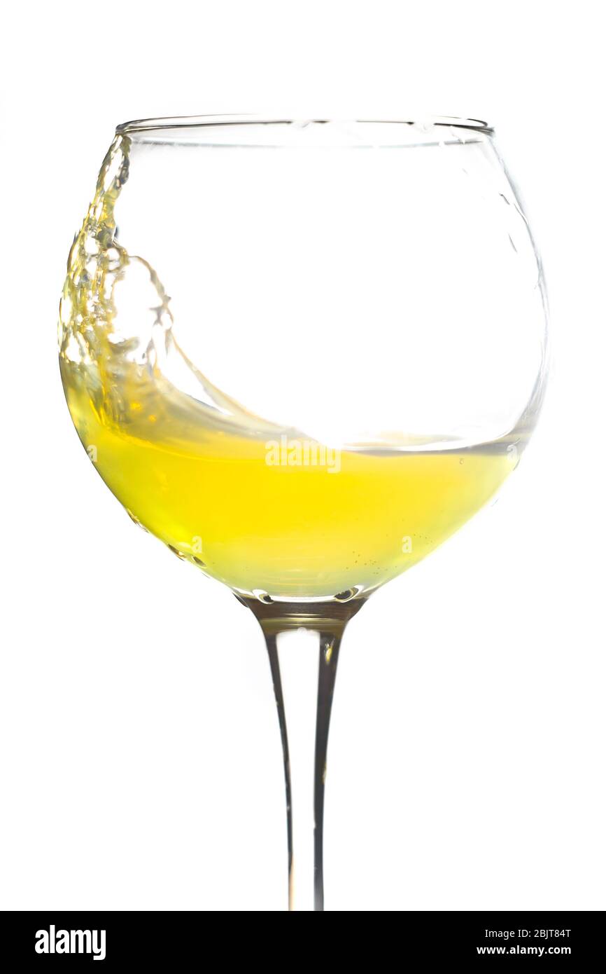 Download Wine Glass Splashing Yellow Juice On A White Background Stock Photo Alamy Yellowimages Mockups