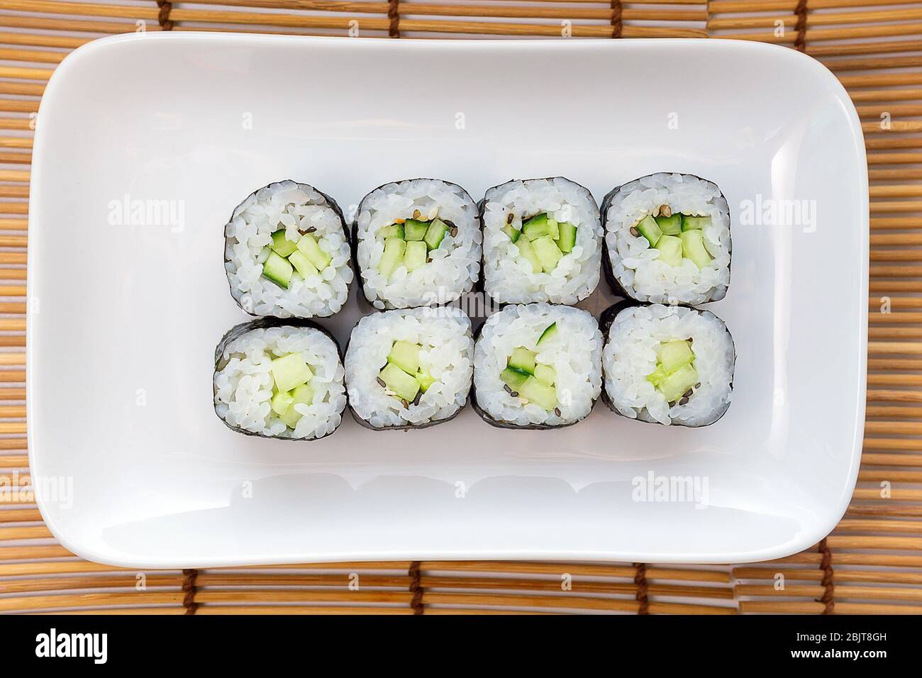 Banquet øre mund Kappa Maki Classic roll with cucumber. Hosomaki thin rolls, small rolls,  with cucumber. top view on a white plate Stock Photo - Alamy