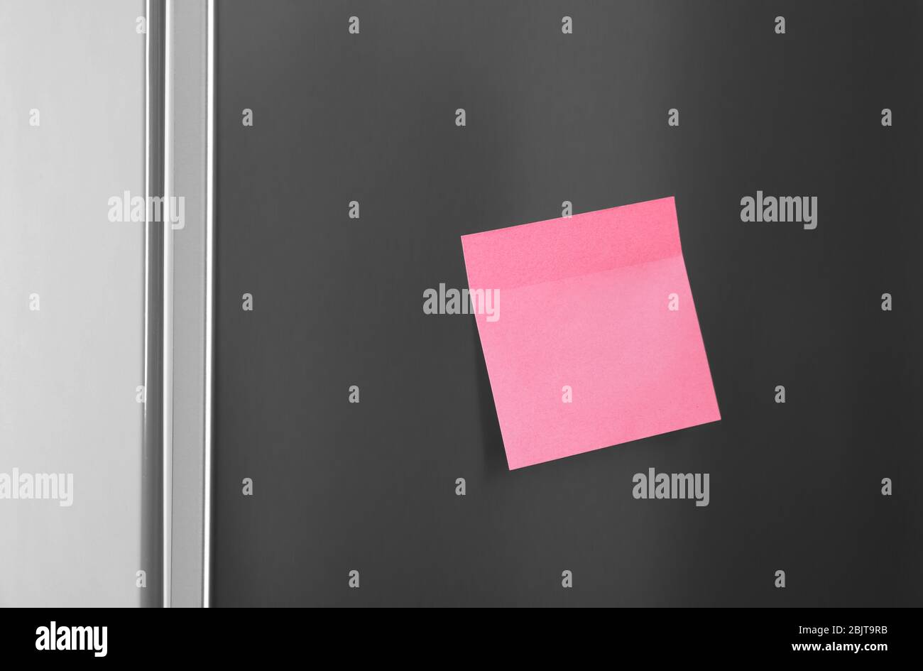 Blank sticky note on refrigerator door Stock Photo Alamy