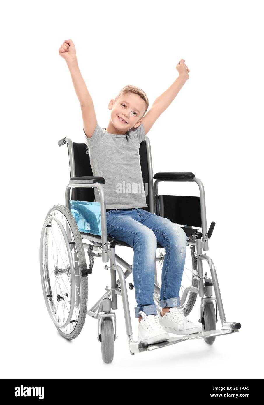 Little boy in wheelchair on white background Stock Photo - Alamy