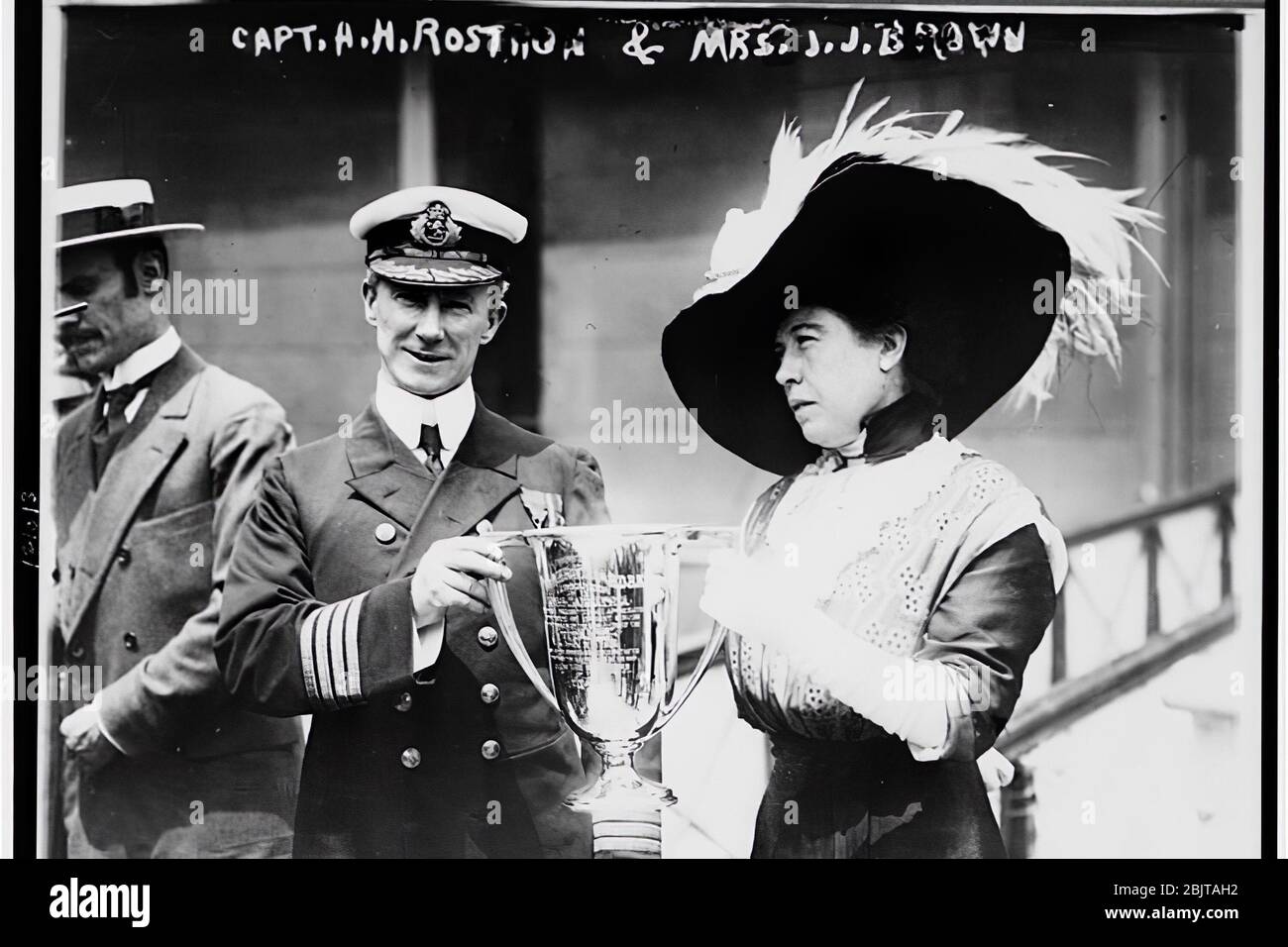 Mrs. J.J. Brown ('The Unsinkable Molly Brown') offering a prize mug award to Carpathia Captain Arthur Henry Roston for his solution in the rescue of the Titanic. Stock Photo