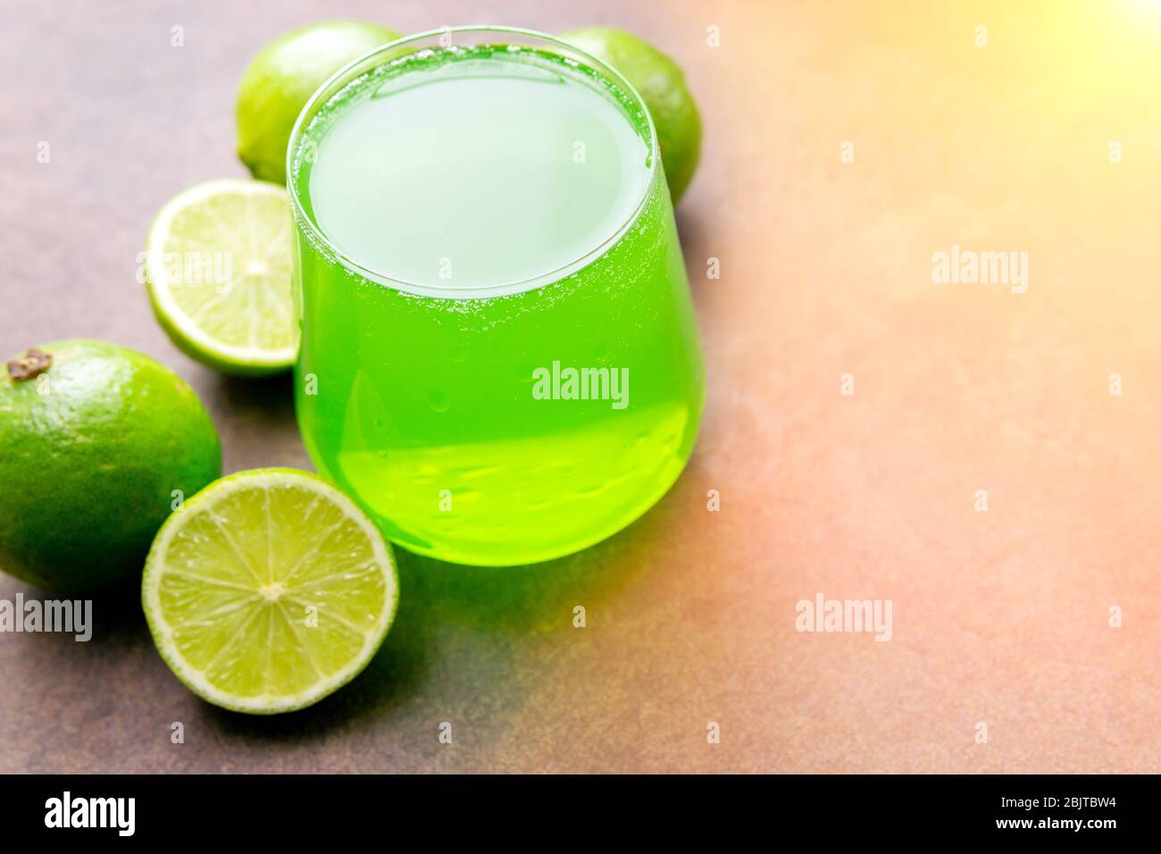 limes juice, lemonade in a glass glass. Healthy lifestyle and detox conceptual background, selective focus Stock Photo