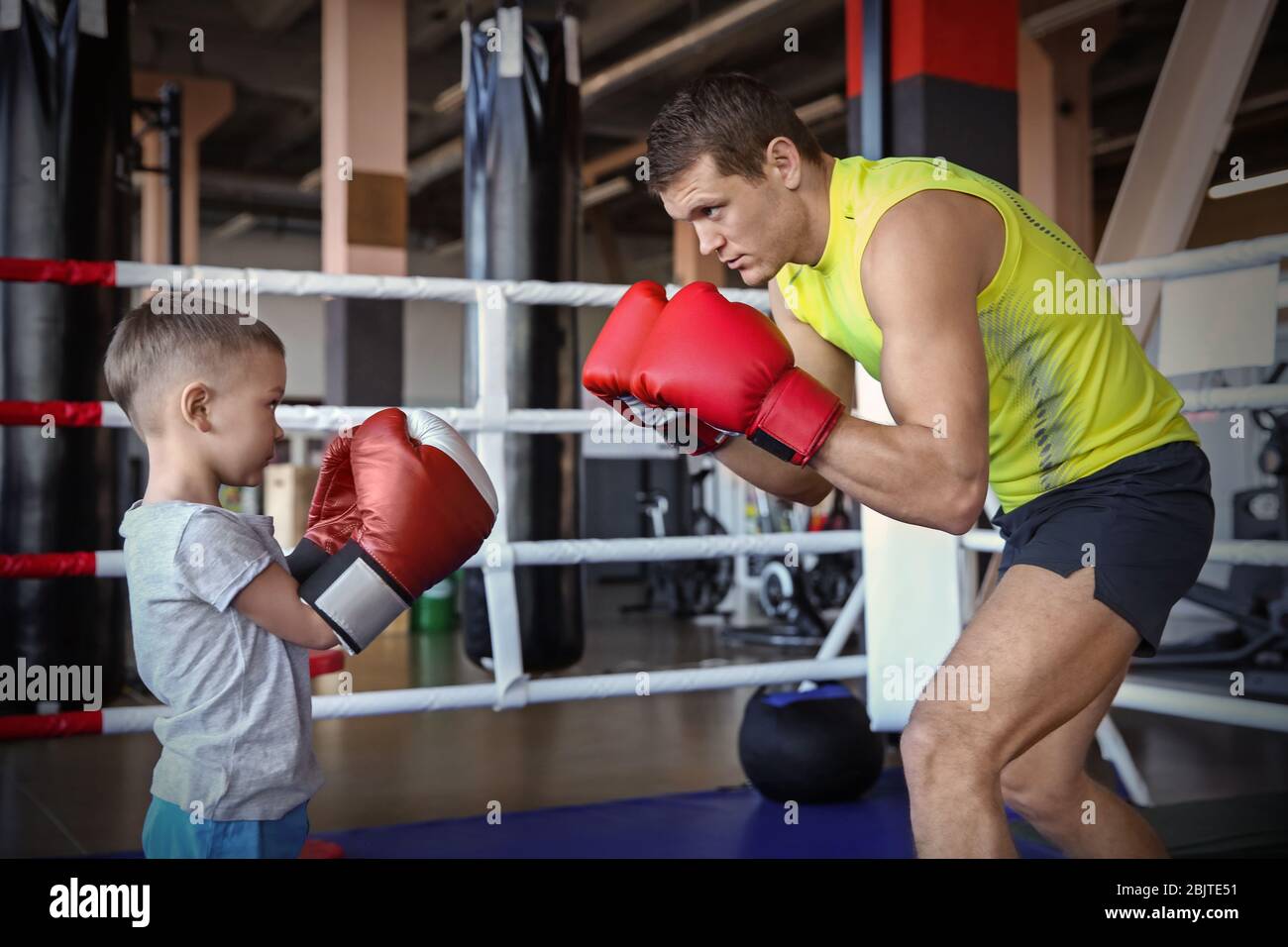 Little children in sportswear on boxing ring Stock Photo - Alamy