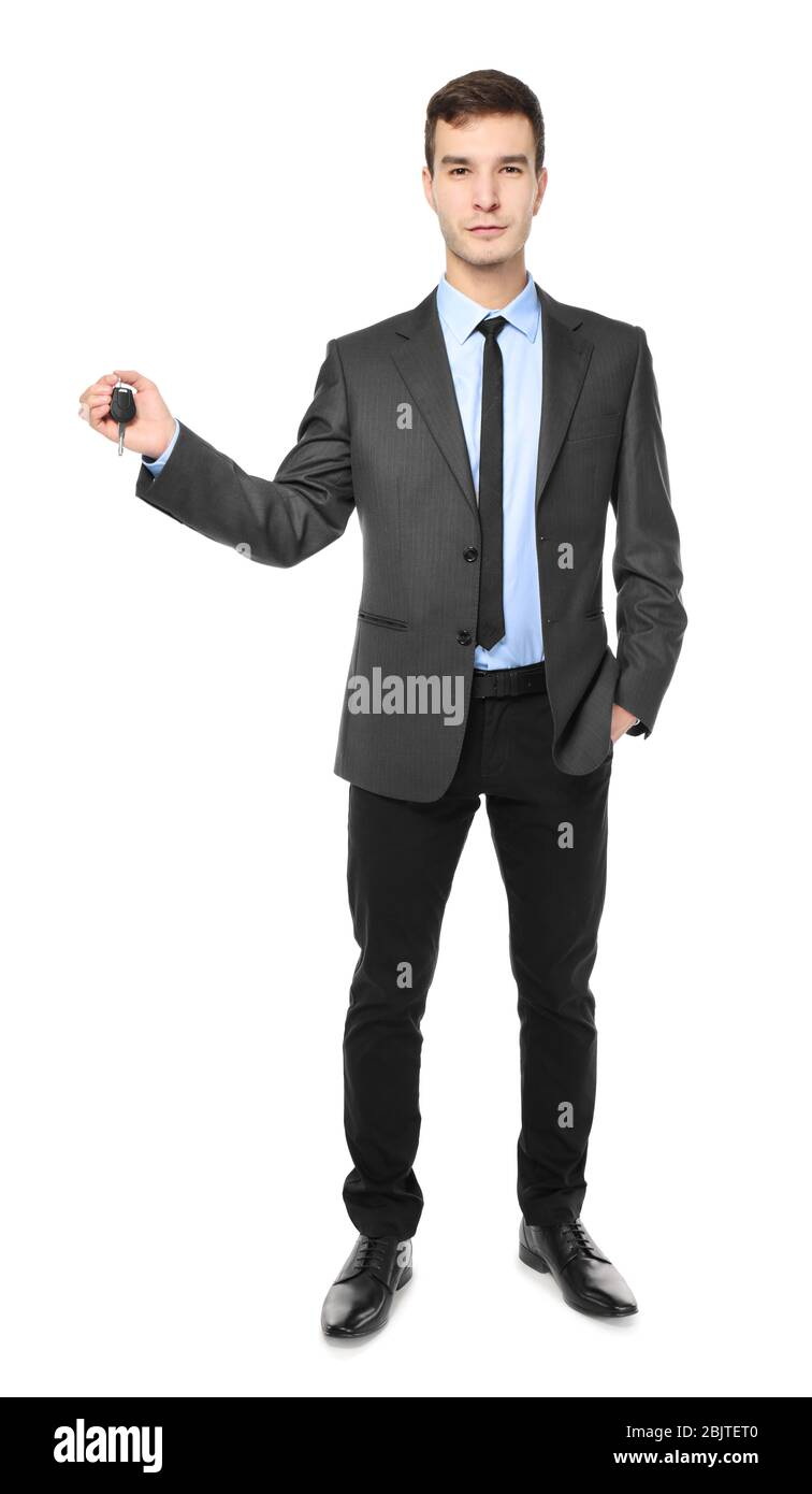 Handsome car salesman with key on white background Stock Photo - Alamy