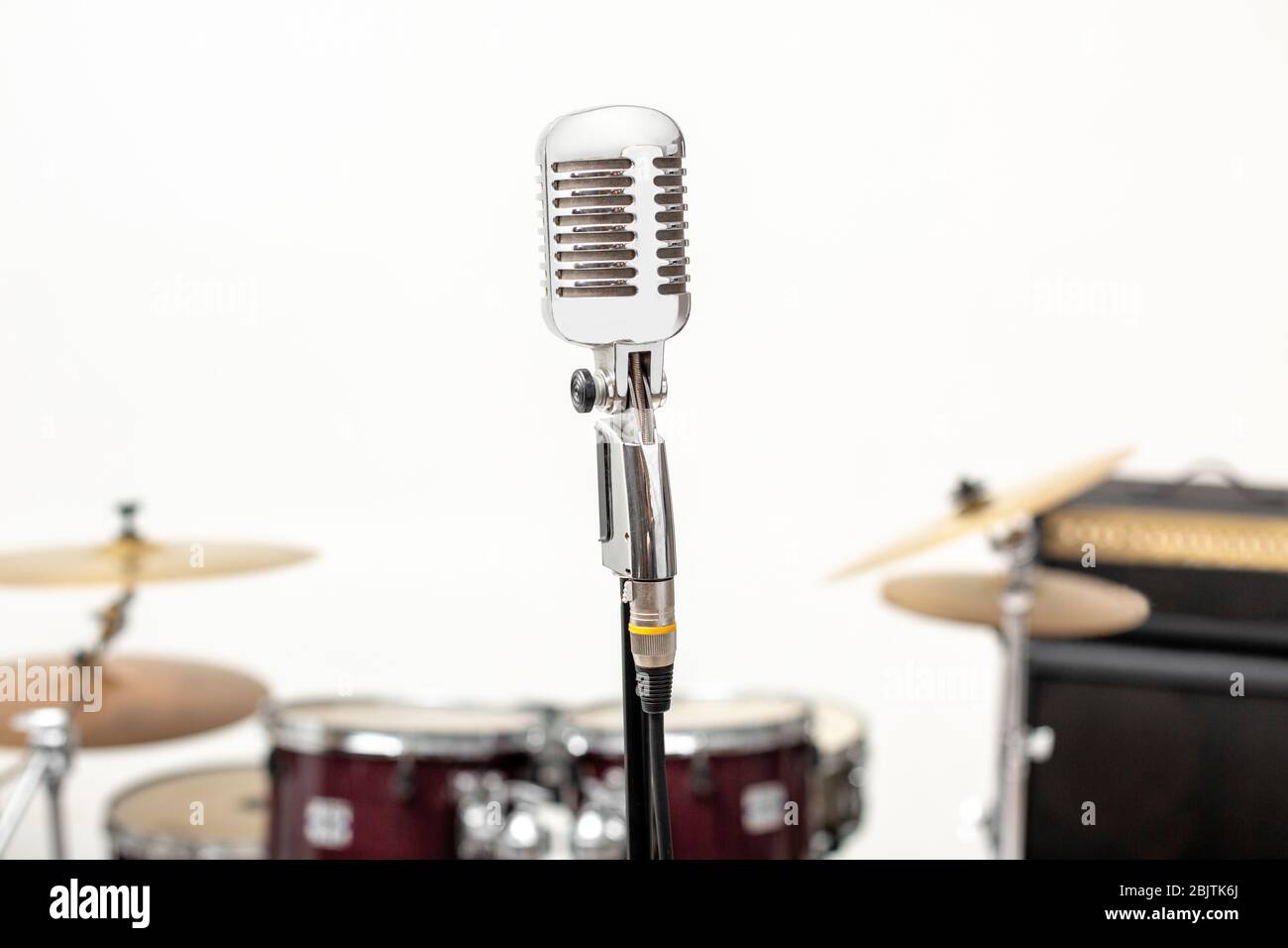 Microphone and music instrument. Microphone in a recording studio with