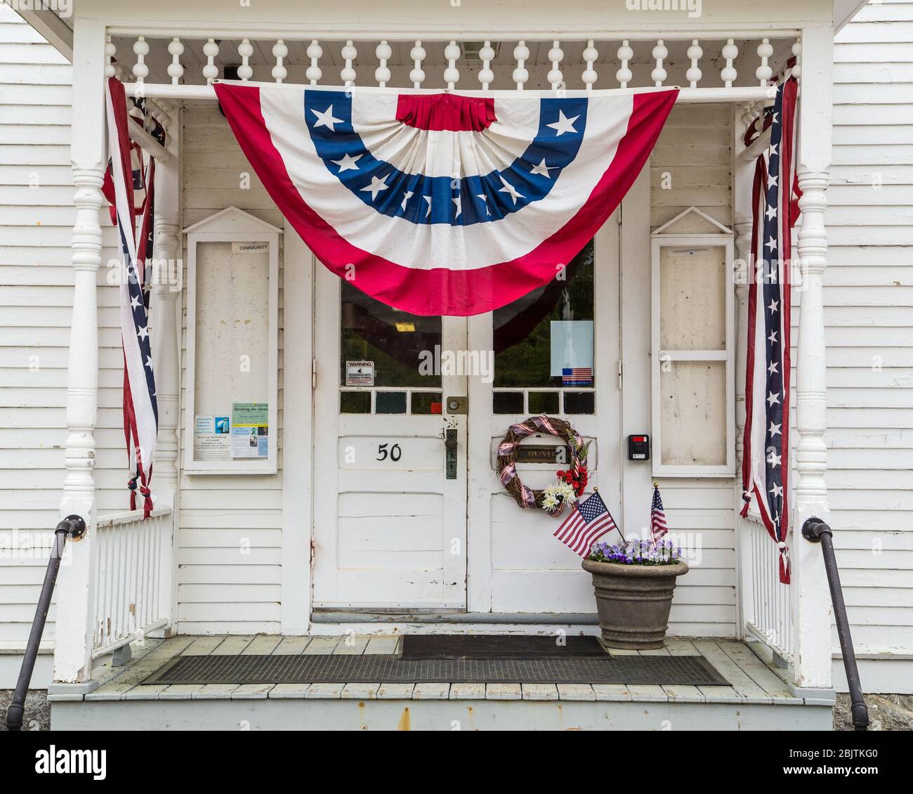 The Phillipston, Massachusetts Town Hall patriotically decorated Stock