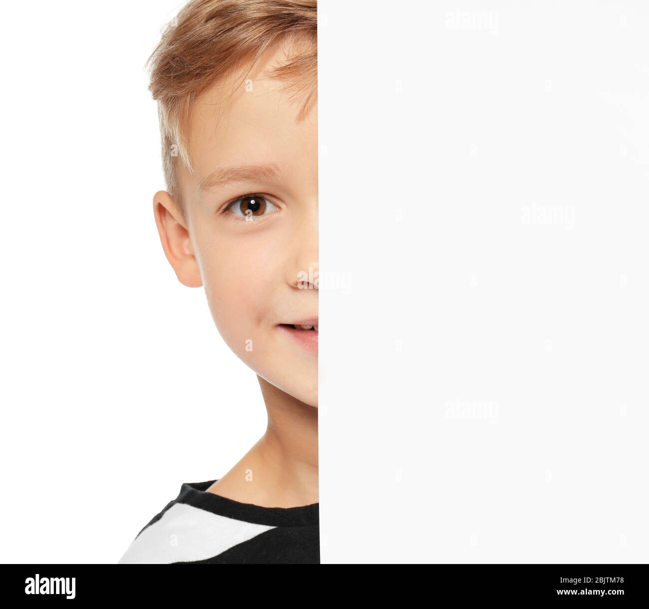 Cute boy with blank advertising board on white background Stock Photo