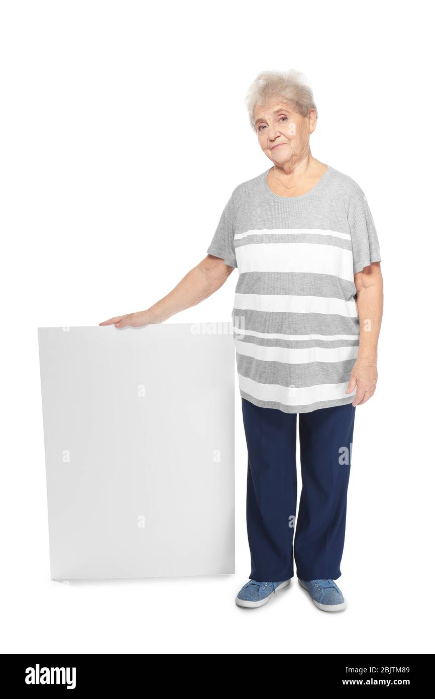 Senior woman with blank advertising board on white background Stock Photo