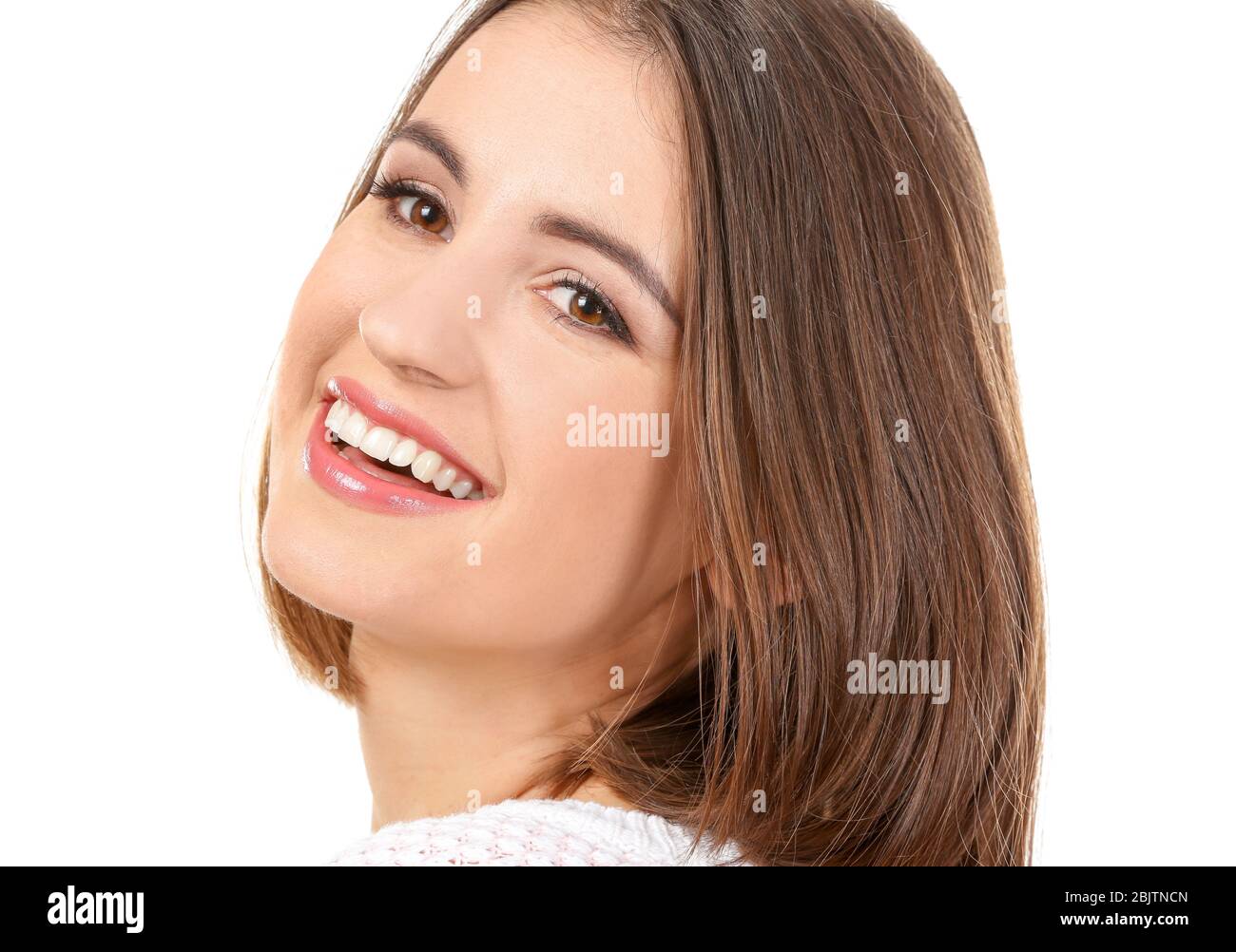 Young smiling woman on white background Stock Photo - Alamy
