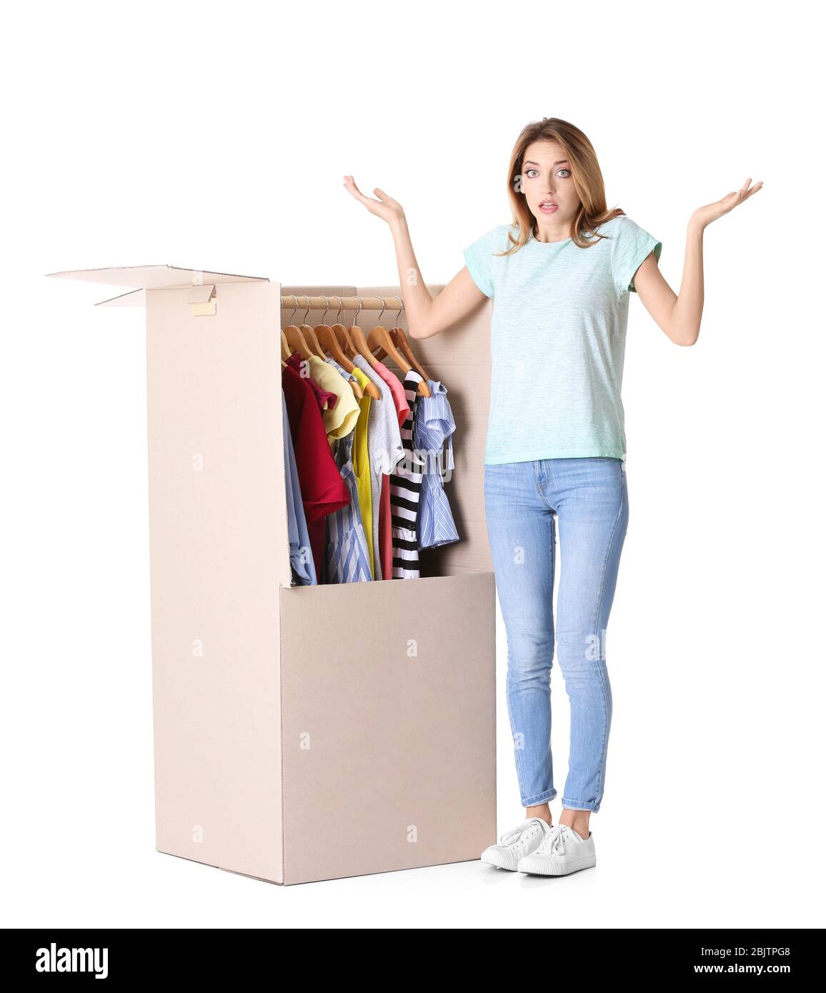 Young woman near wardrobe box on white background Stock Photo Alamy