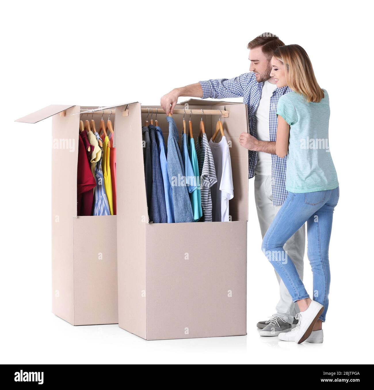 Young couple near wardrobe boxes on white background Stock Photo Alamy