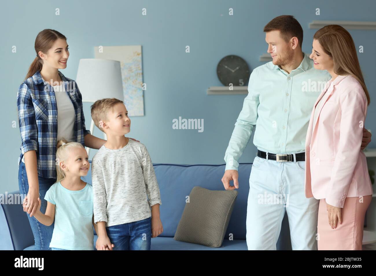 parents-leaving-their-children-with-nanny-at-home-stock-photo-alamy