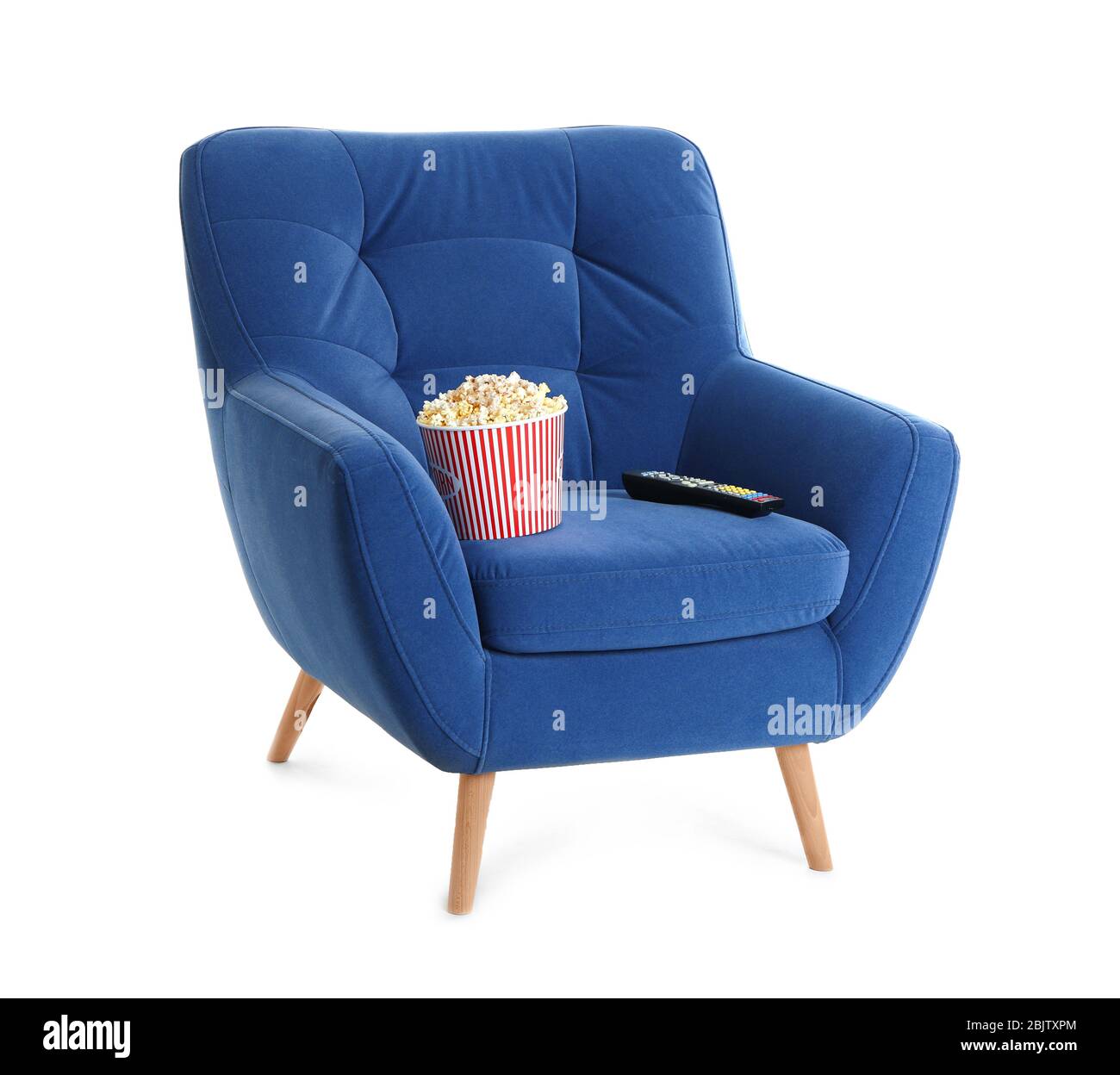Comfortable armchair with popcorn and remote control for home cinema on  white background. Watching movie Stock Photo - Alamy