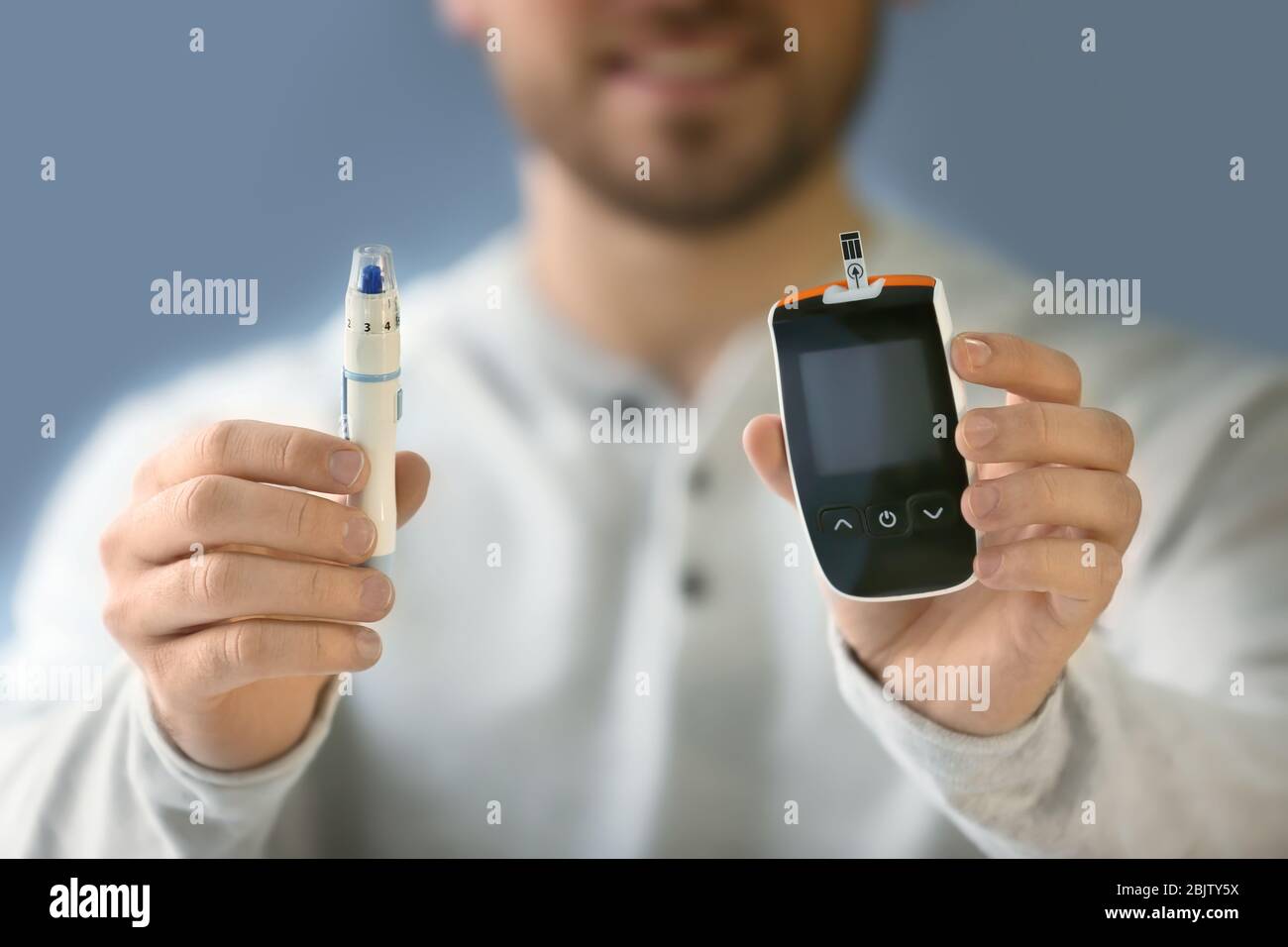 Man Using Glucometer Diabetic man with digital glucometer and lancet pen, closeup Stock ...