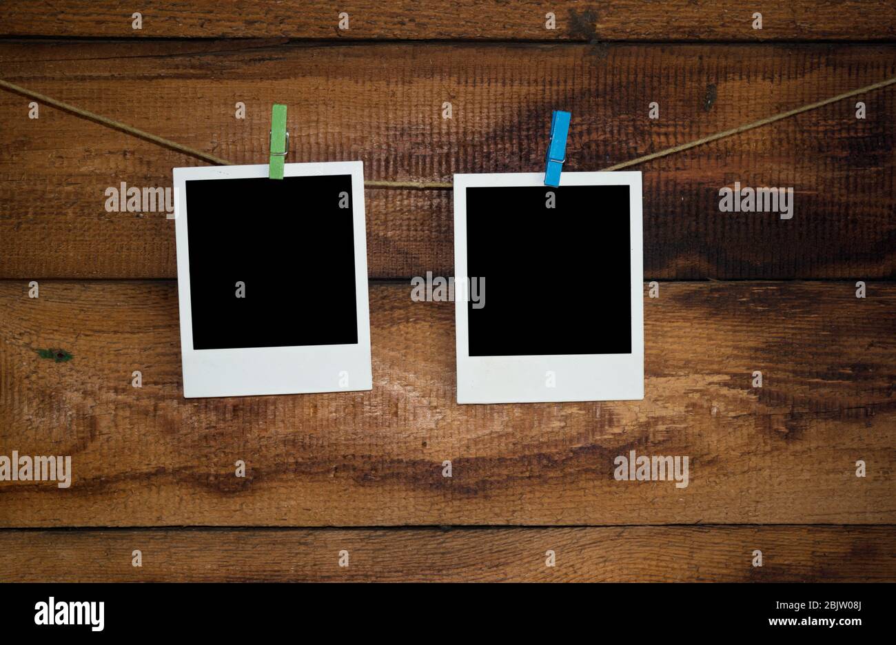Photo frames on a rope Stock Photo - Alamy