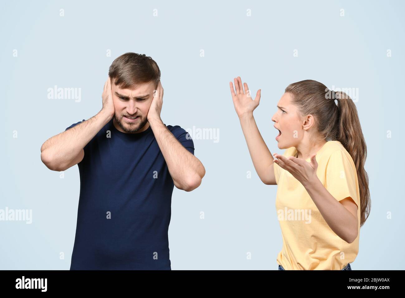 Couple arguing on light background. Problems in relationship Stock ...