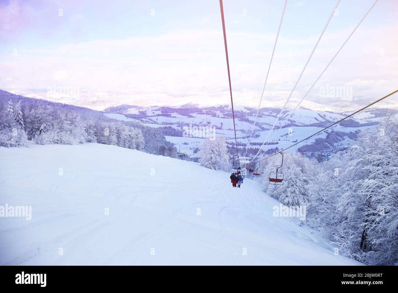 Ski lift at snowy resort in mountains Stock Photo - Alamy
