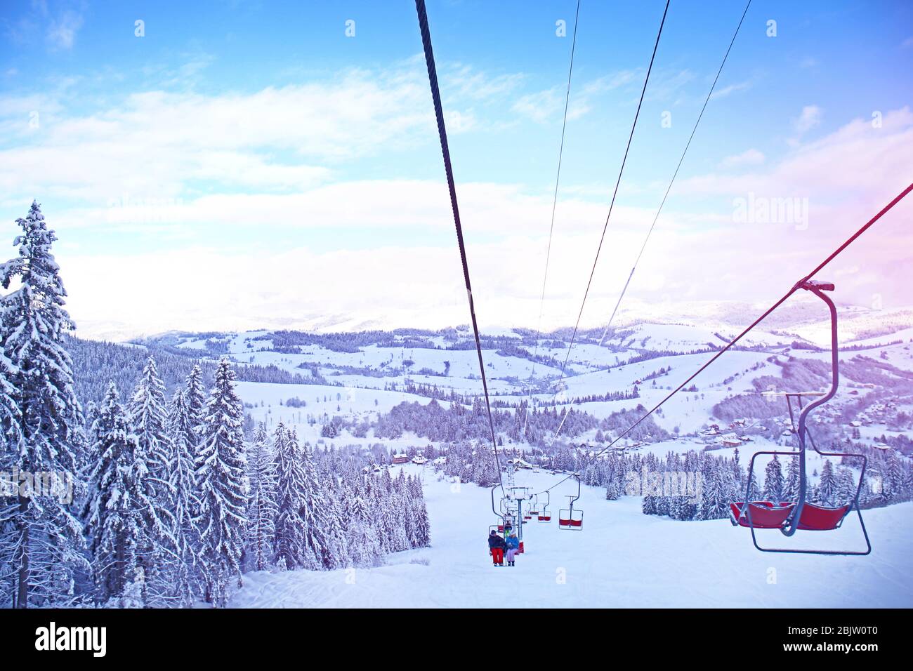Ski lift at snowy resort in mountains Stock Photo - Alamy